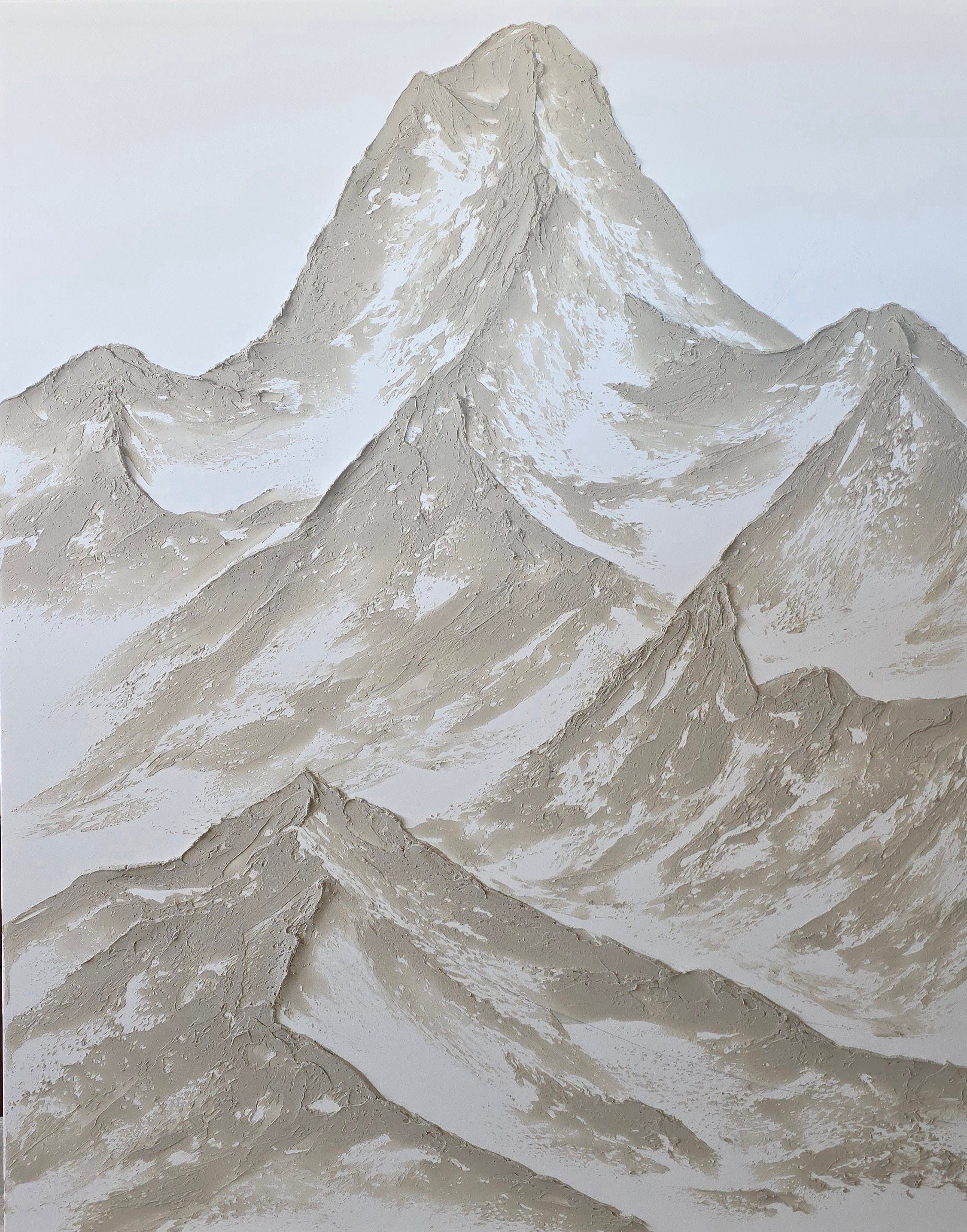 Textured mountain wall art with a neutral color palette